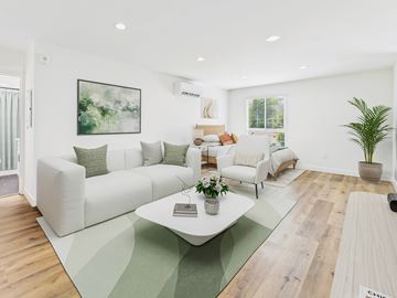 Los Angeles apartment for rent - A living room with a white couch and a green rug.