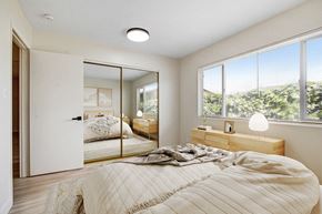 Ventura apartment for rent - a bedroom with a large bed and a large window
