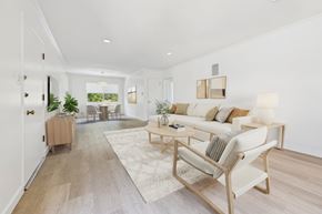 Santa Monica apartment for rent - A living room with a white couch and a wooden floor.