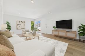 Santa Monica apartment for rent - A living room with a white couch and a wooden coffee table.