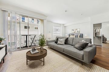 Los Angeles apartment for rent - A living room with a grey couch and a brown coffee table.