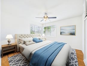 Santa Monica apartment for rent - A bedroom with a large bed and a ceiling fan.