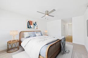 Sherman Oaks apartment for rent - A bedroom with a large bed and a ceiling fan.