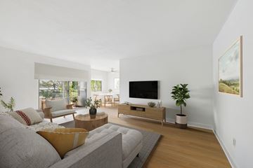 Sherman Oaks apartment for rent - A living room with a grey couch and a wooden coffee table.