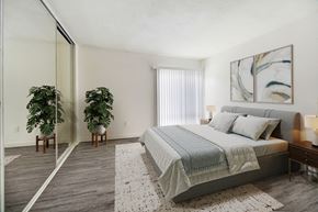 Sherman Oaks apartment for rent - a bedroom with a bed and a large mirror