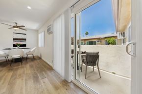 Sherman Oaks apartment for rent - A patio with a table and chairs is shown.