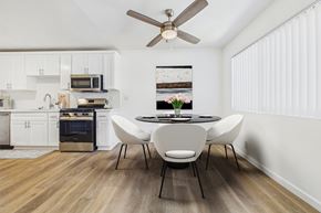 Sherman Oaks apartment for rent - A modern kitchen with a dining table set for four.