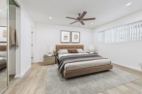 Sherman Oaks apartment for rent - A bedroom with a large bed and a ceiling fan.