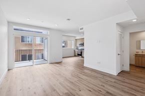 Winnetka apartment for rent - A spacious room with wooden flooring and white walls.