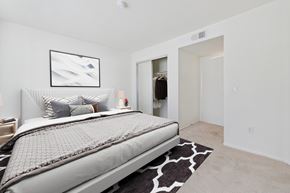 Valley Village apartment for rent - A bedroom with a large bed and a painting on the wall.
