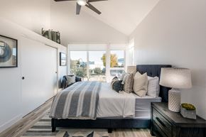 Los Angeles apartment for rent - A bedroom with a large bed and a ceiling fan.