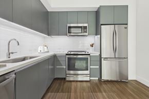 Los Angeles apartment for rent - A modern kitchen with a stainless steel refrigerator and oven.