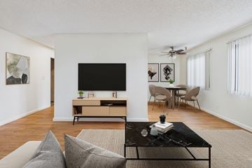 Van Nuys apartment for rent - A living room with a black coffee table and grey couch.