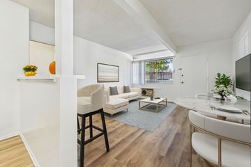 North Hollywood apartment for rent - A living room with a white couch and a wooden floor.