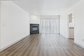 Los Angeles apartment for rent - A room with a fireplace and a sliding door.