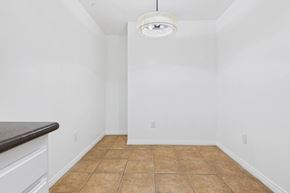 Los Angeles apartment for rent - A room with a brown tile floor and white walls.
