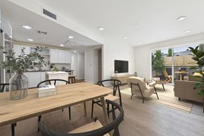 Los Angeles apartment for rent - A modern dining area with a wooden table and chairs.