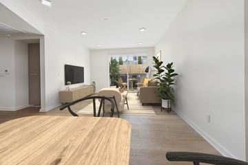 Los Angeles apartment for rent - A modern living room with a wooden table and a flat screen TV.