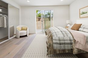 Los Angeles apartment for rent - A bedroom with a large bed and a chair.
