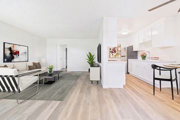 Arleta apartment for rent - A modern living room with a white sofa and a grey rug.