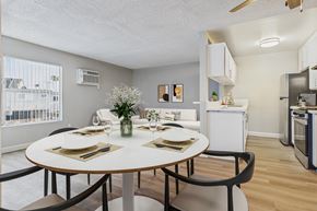 North Hills apartment for rent - A dining room with a round table set for two.