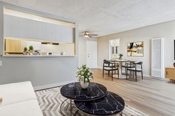 North Hills apartment for rent - A living room with a black marble coffee table and a white sofa.