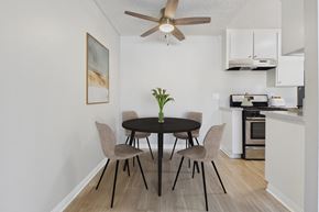 North Hills apartment for rent - A dining room with a table and chairs.