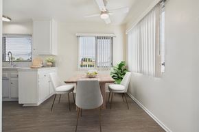 Garden Grove apartment for rent - A modern kitchen with a dining table and chairs.