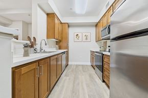 Chatsworth apartment for rent - A kitchen with wooden cabinets and stainless steel appliances.