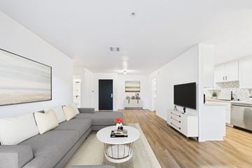 Pasadena apartment for rent - A living room with a grey couch and a white coffee table.