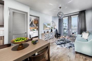 Culver City townhouse for rent - A modern living room with a dining table and chairs.
