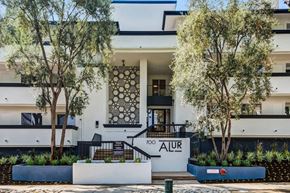 Pasadena apartment for rent - A modern building with a black and white facade and a patterned door.
