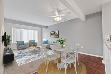 Placentia apartment for rent - A living room with a dining table and chairs.