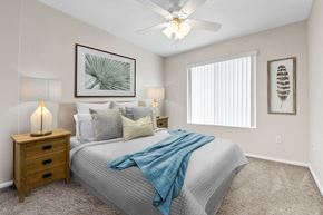 Placentia apartment for rent - a bedroom with a large bed and a ceiling fan