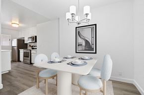 Los Angeles apartment for rent - A dining room with a white table and chairs.