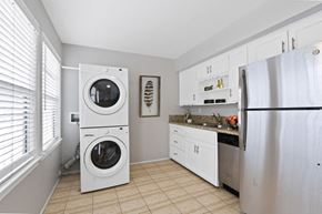 Marina Del Rey townhouse for rent - a washer and dryer in a kitchen with a sink and refrigerator
