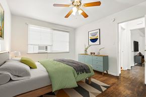 West Hollywood apartment for rent - a bedroom with a bed and a ceiling fan