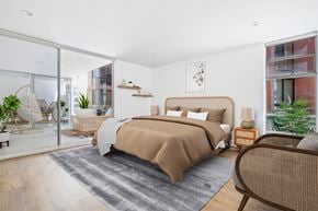 Santa Monica apartment for rent - a bedroom with a bed and a sliding glass door