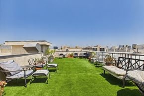 Los Angeles apartment for rent - A patio with a lawn and chairs.