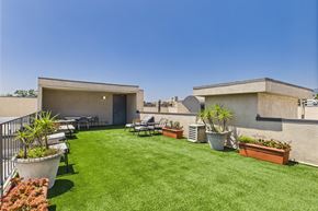 Los Angeles apartment for rent - A backyard with a lawn and a patio.