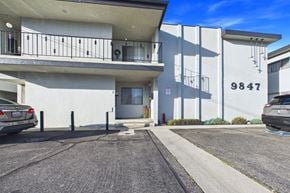Bellflower apartment for rent - A car is parked in front of a building with the number 9847 on it.
