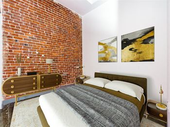 Exposed brick walls and concrete columns*