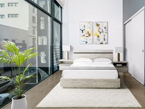 Los Angeles apartment for rent - Studio Apartments In Downtown Los Angeles, CA - Broadway Lofts - High Ceiling Bedroom With Sliding Door Closet And Floor to Ceiling Large Windows