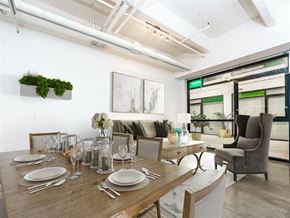 Los Angeles apartment for rent - Studios in Downtown Los Angeles, CA - Broadway Lofts - Living Room with an Open Layout, Large Windows, and Exposed Pipes