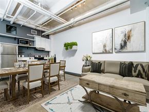Los Angeles apartment for rent - a living area with a couch table and chairs and a kitchen in the background