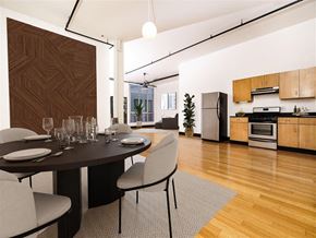 Los Angeles apartment for rent - a dining area with a table and chairs and a kitchen in the background