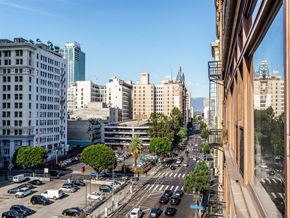 Los Angeles apartment for rent - 1-Bedroom Apartments in Downtown Los Angeles, CA - Mercantile Lofts - Balcony View Of A High-Angle, Sunlit View Of A City Street.