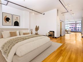 Los Angeles apartment for rent - a bedroom with a large bed and a hardwood floor
