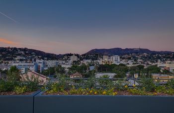 Rooftop panoramic views of downtown la, the hollywood sign, and century city