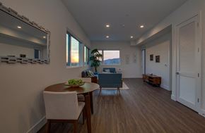 Los Angeles apartment for rent - A dining room with a wooden table and chairs.